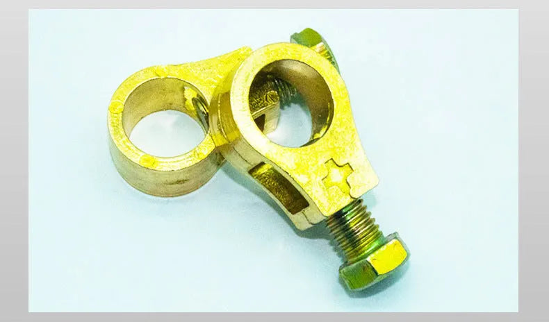 Solid copper battery terminal clamp with patented fastening clip for car battery connections.