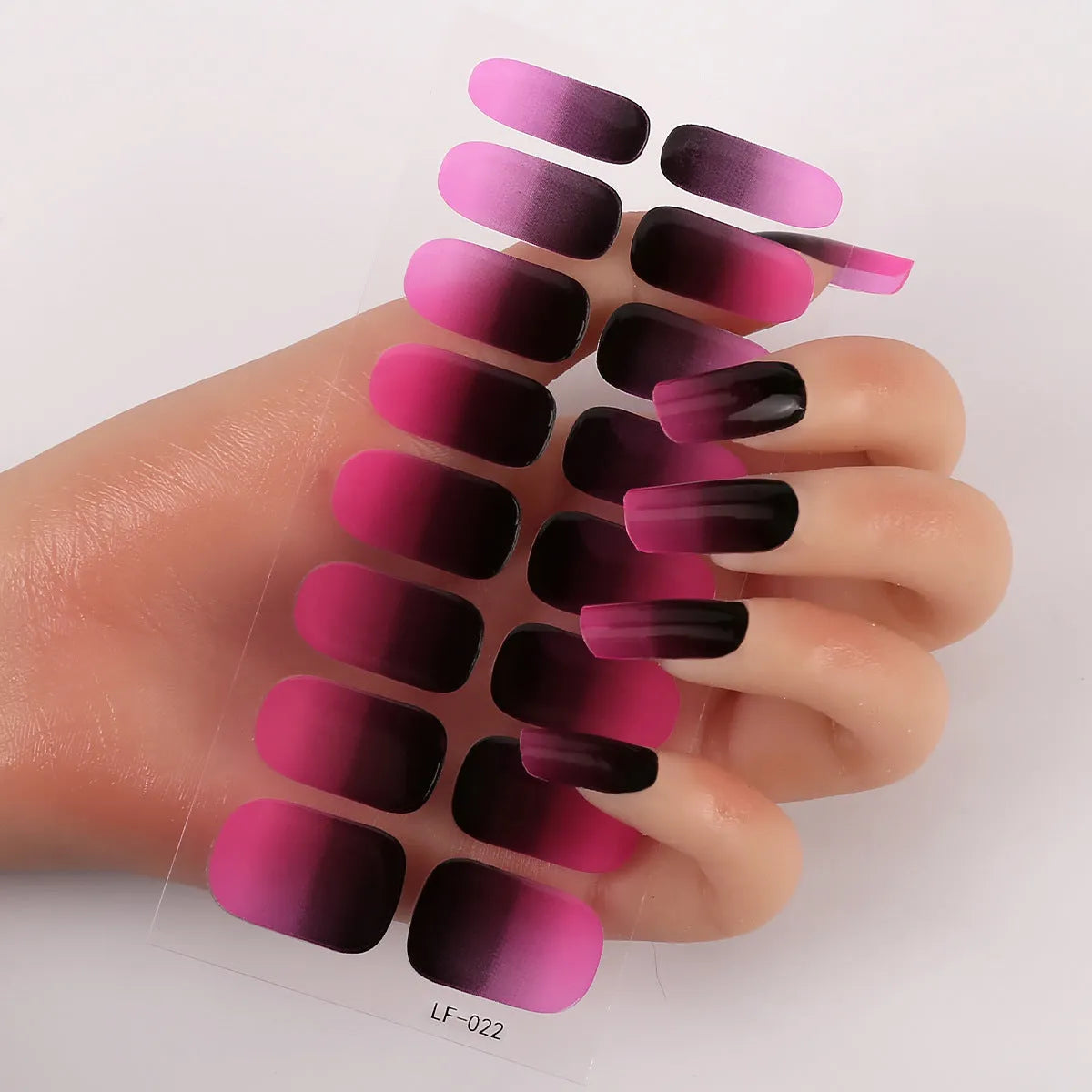 16 solid colour full nail art stickers with 22 patterns including cross, rose, butterfly designs in 12x6mm oval size