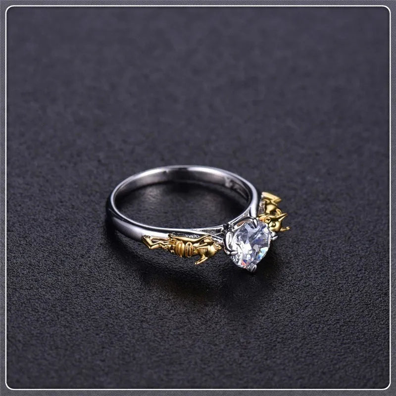 Detailed black gold copper crown ring on a finger, showing crown modelling and metallic finish.