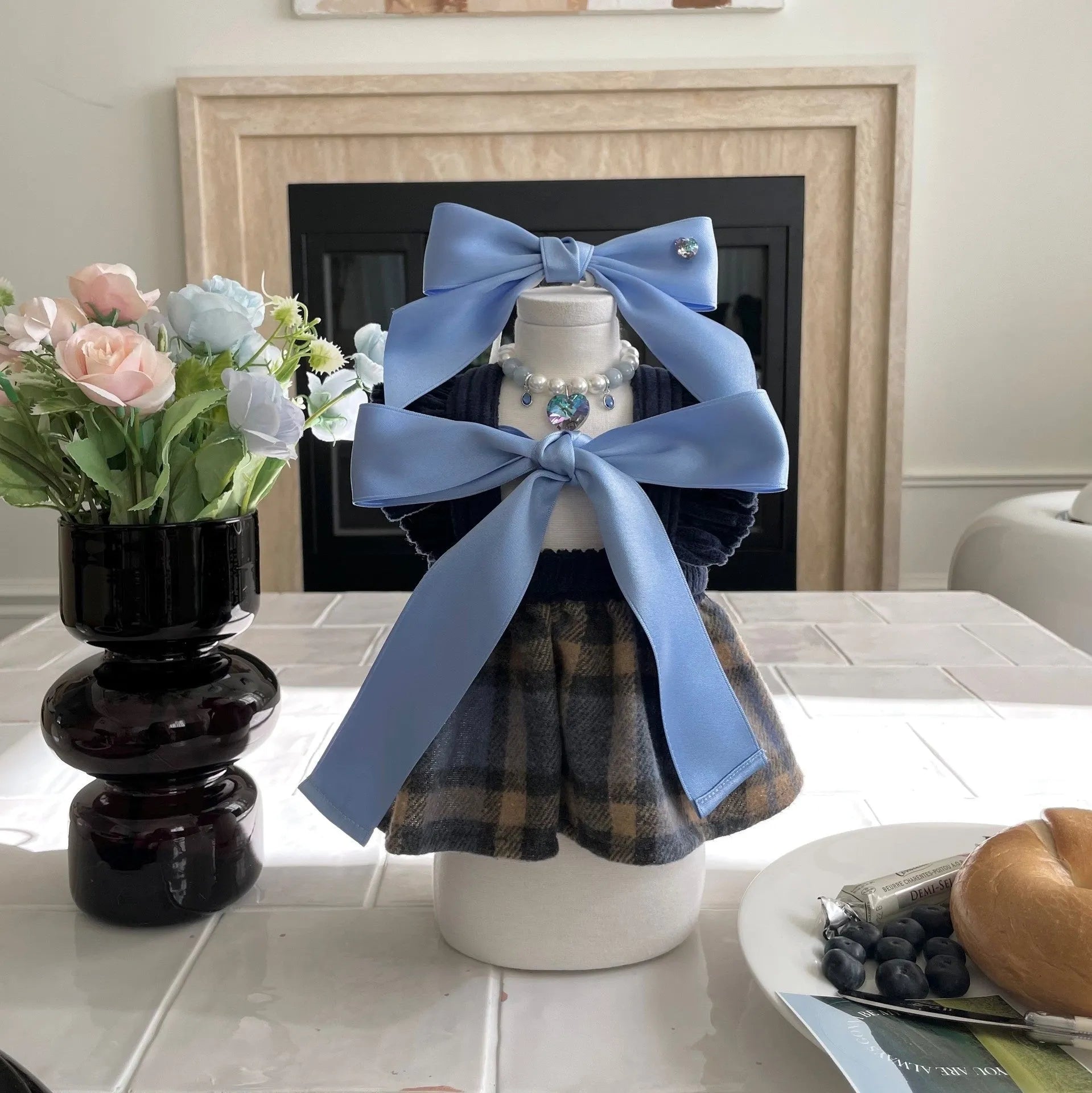 Blue and pink adjustable bow dog headdress hair band on a white background.