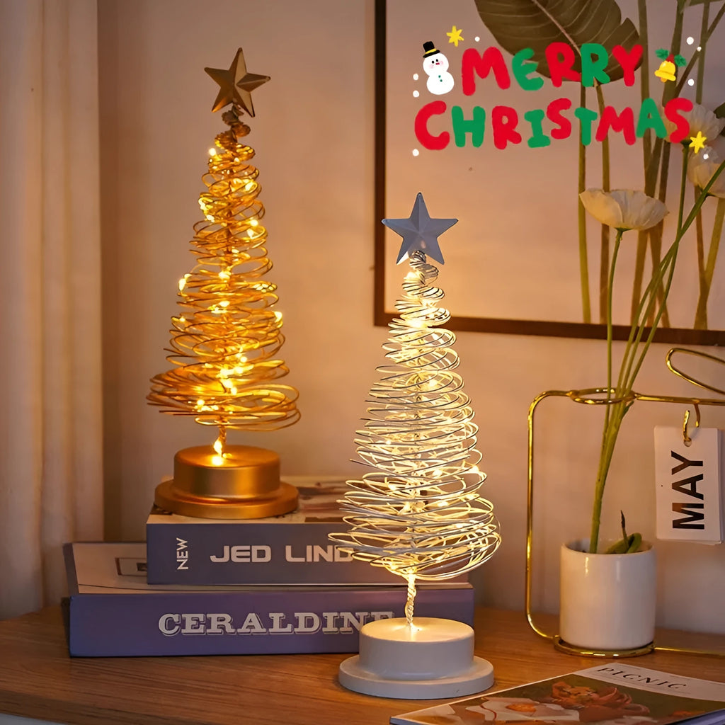 Wrought iron LED Christmas tree spiral light on a table, glowing warm white.