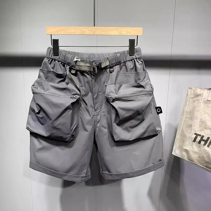 Men's black loose fit work shorts with pockets and straight leg hem above knee length