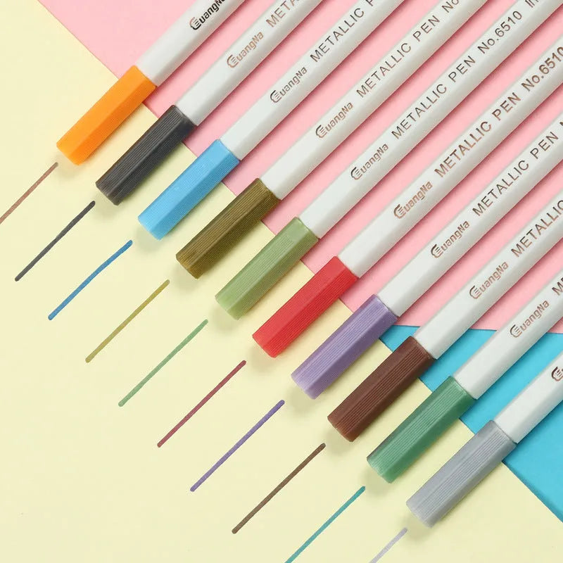 Black plastic card album with coloured metal pens arranged on a white background for office stationery use.