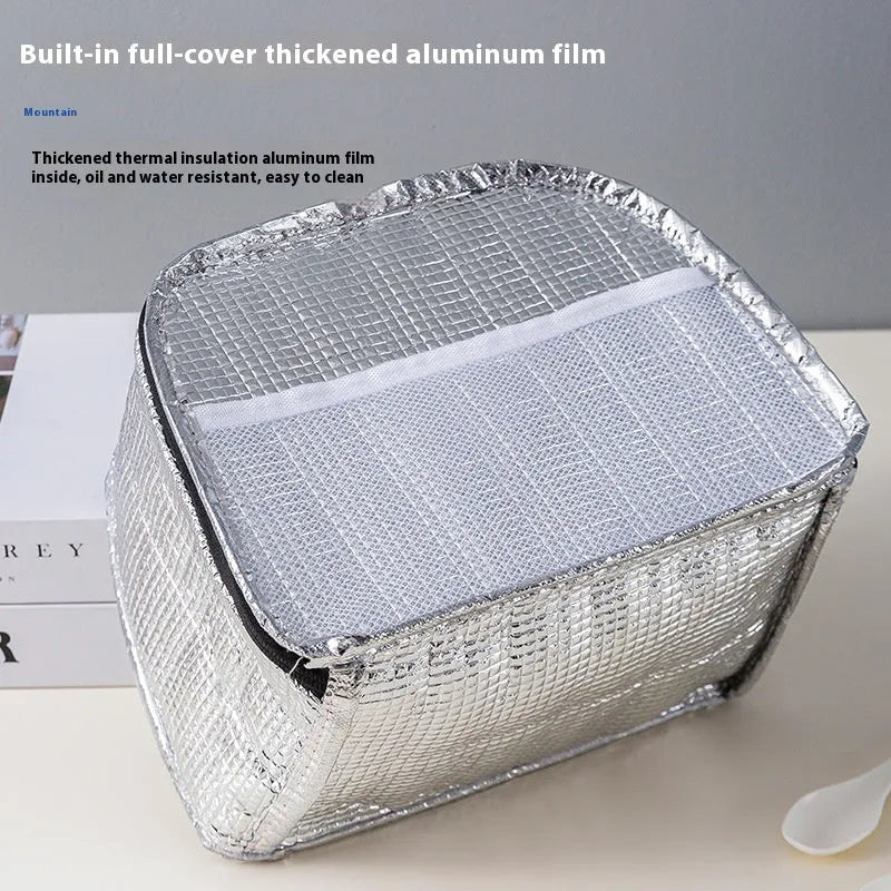 Insulated lunch bag in textured cloth material with bento handbag style and modern minimalist design