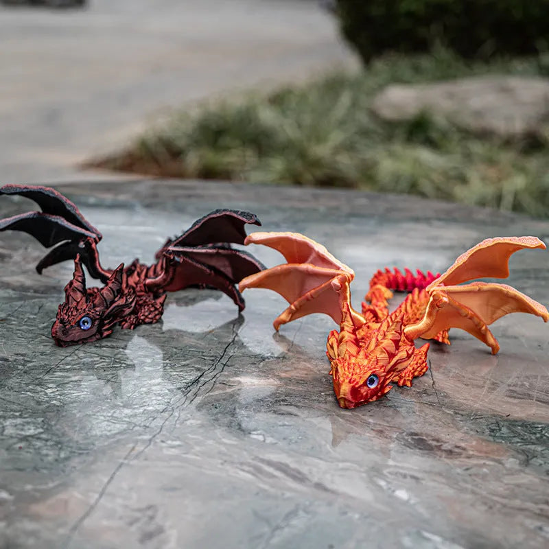 Red and gold PLA flying dragon wings decoration toy measuring 25cm wide.