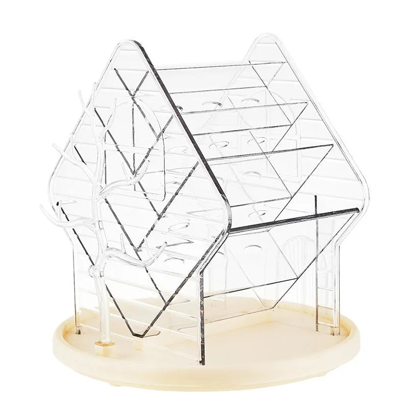 Transparent plastic rotating cosmetics storage box in clear and amber gold colour on a vanity table.