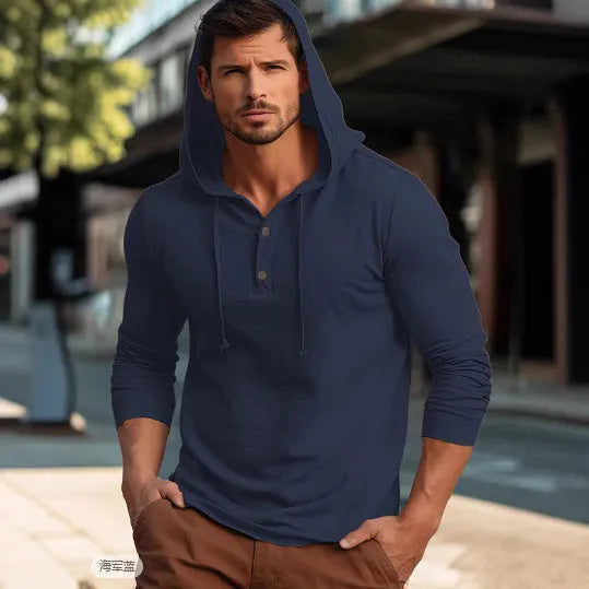 A dark blue cotton pullover hoodie with long sleeves on a hanger.