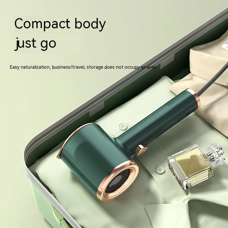 Mini portable handheld garment steamer in green with titanium soleplate and 50ml water tank