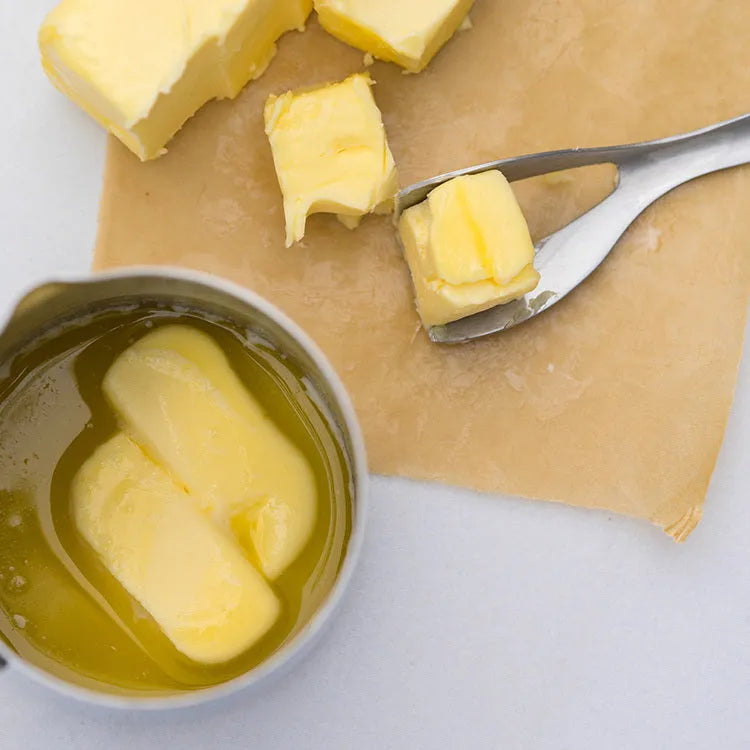 Stainless steel butter cutter with 12cm 304 stainless steel edged blade on a kitchen surface