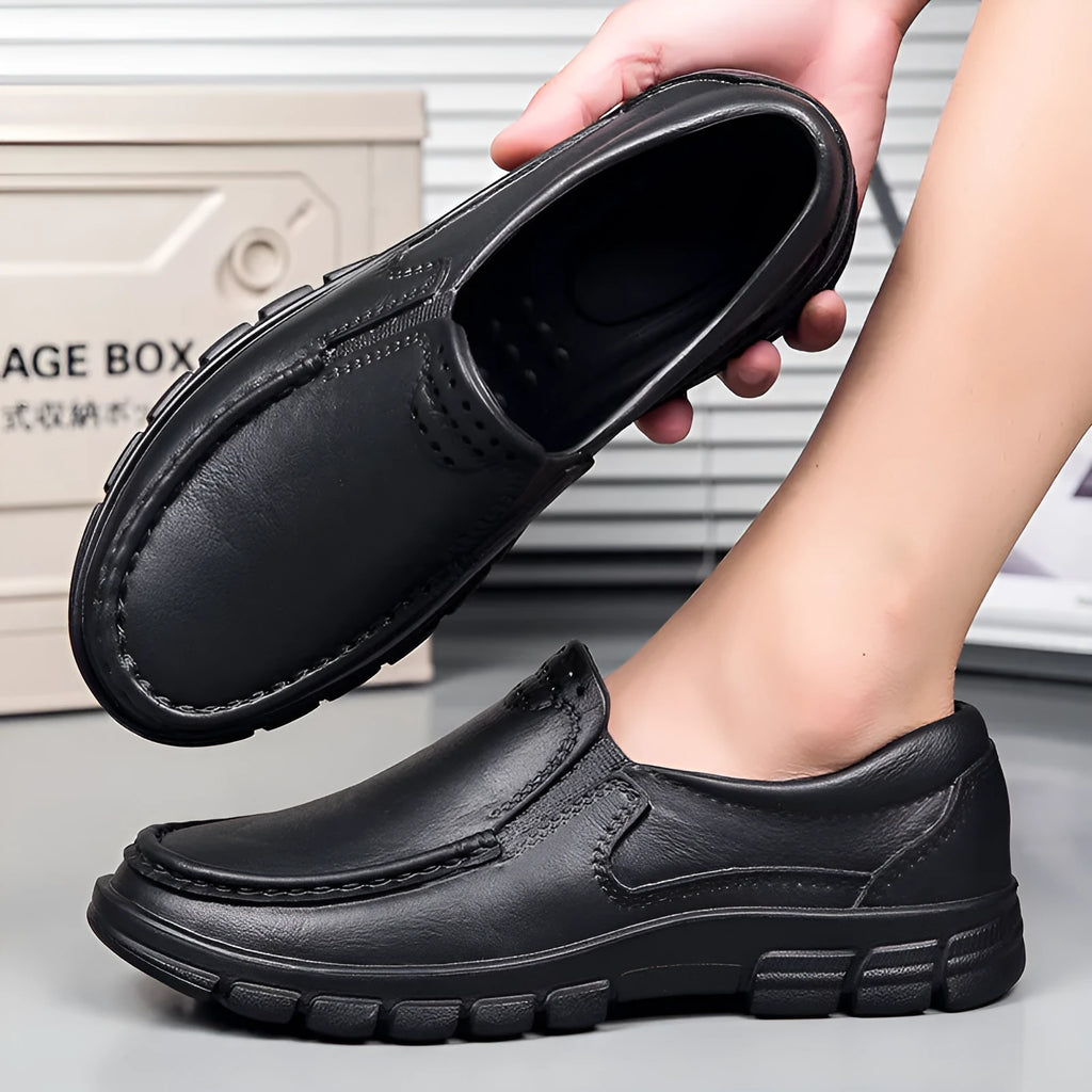 Men's black waterproof slip-on work shoes with platform sole and leather lining