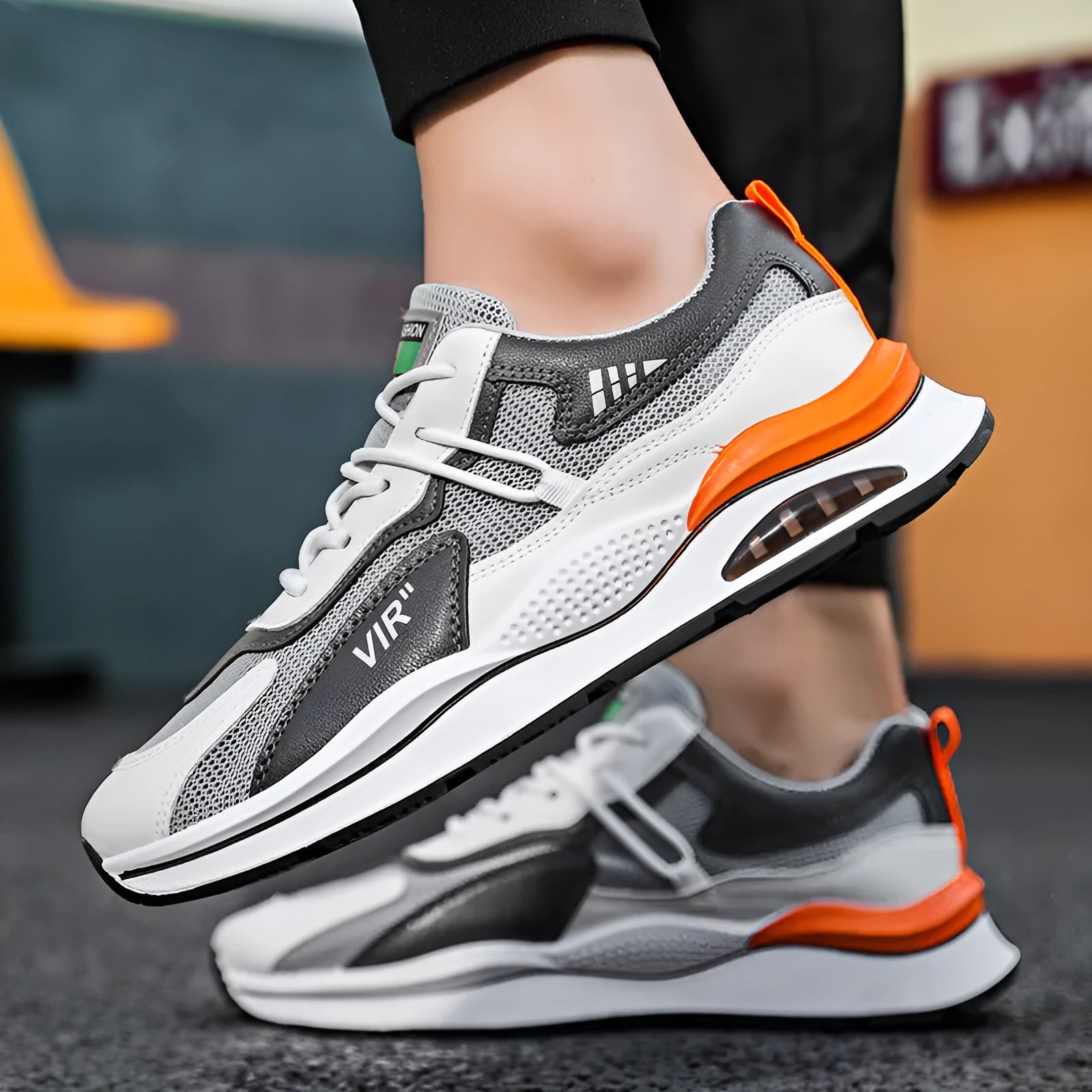Men's grey breathable mesh running shoes with a round toe and EVA sole on a white background