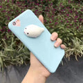 Soft pink silicone iPhone case with a raised 3D white cartoon cat design on the back.