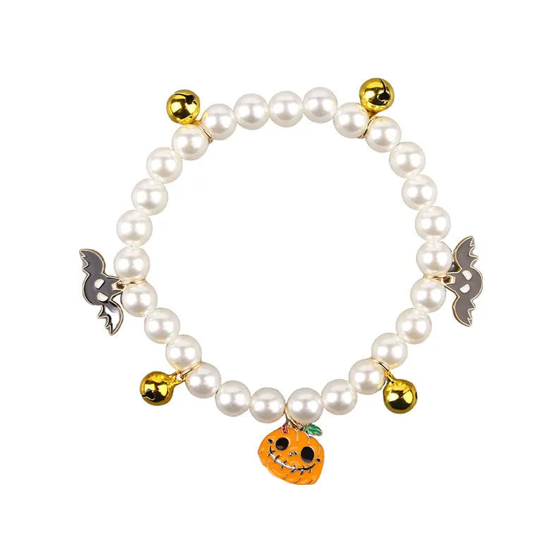 Halloween cat collar with simulated pearl necklace decoration in purple ghost pumpkin design.