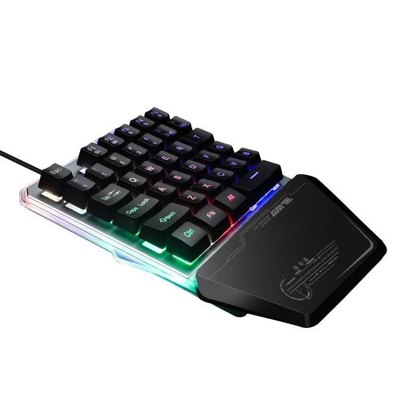 Black G40 Flow one-handed mechanical keyboard with RGB backlit keys on a desk
