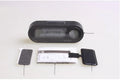 Black electronic car clock and thermometer with LED display on an adjustable bracket.