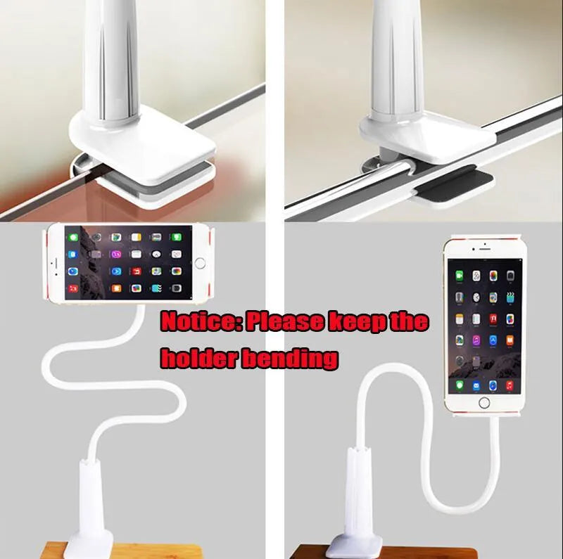 Black aluminium alloy bedside phone handset with a long arm and wide clamp, holding a mobile phone above a bed.