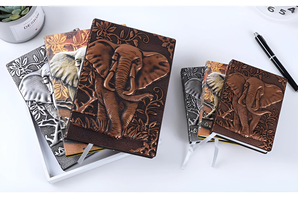 PU leather A5 notebook with three-dimensional embossed cover and bronze highlights, open to beige pages