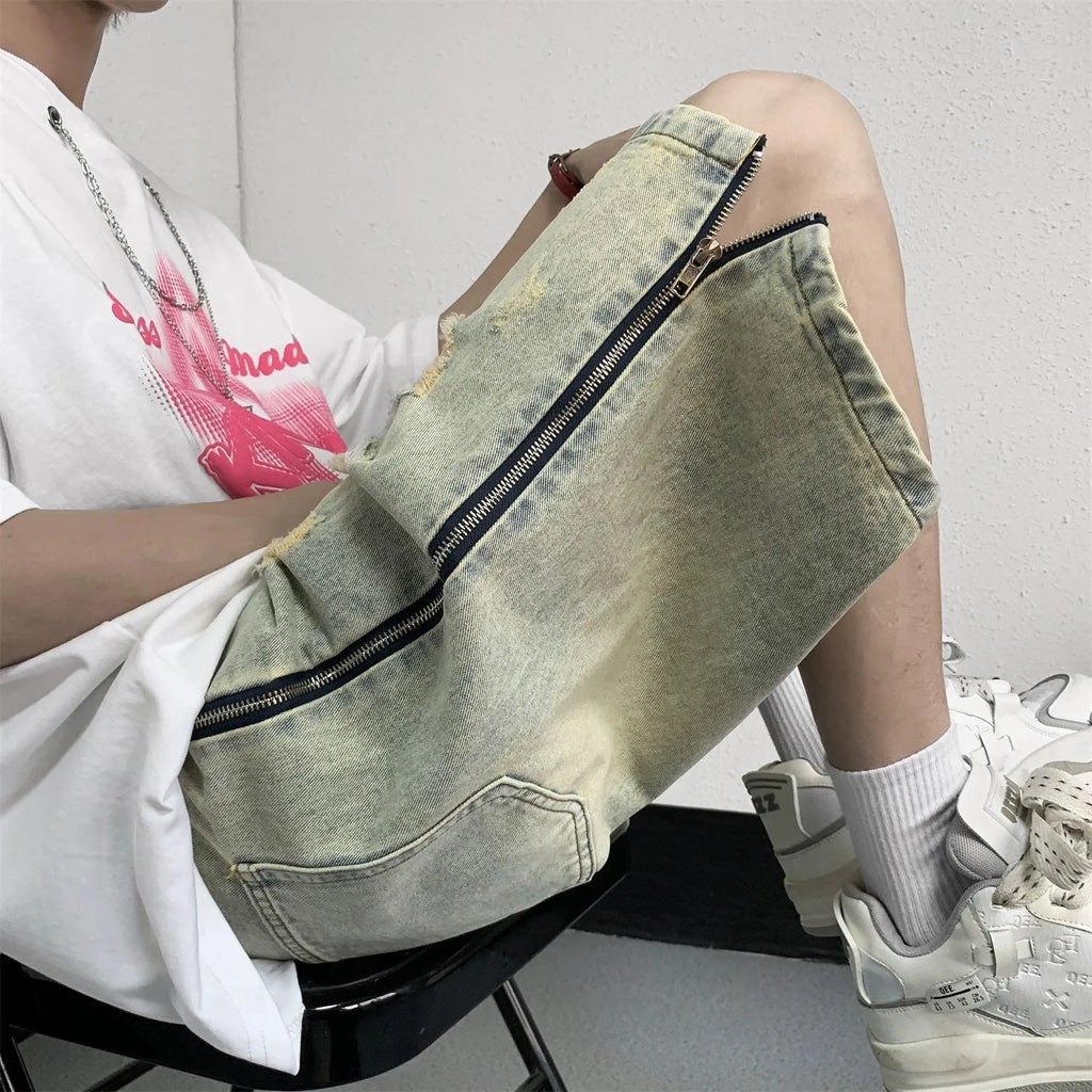 Men's blue retro denim shorts with five-point ripped distressing and yellow mud wash finish