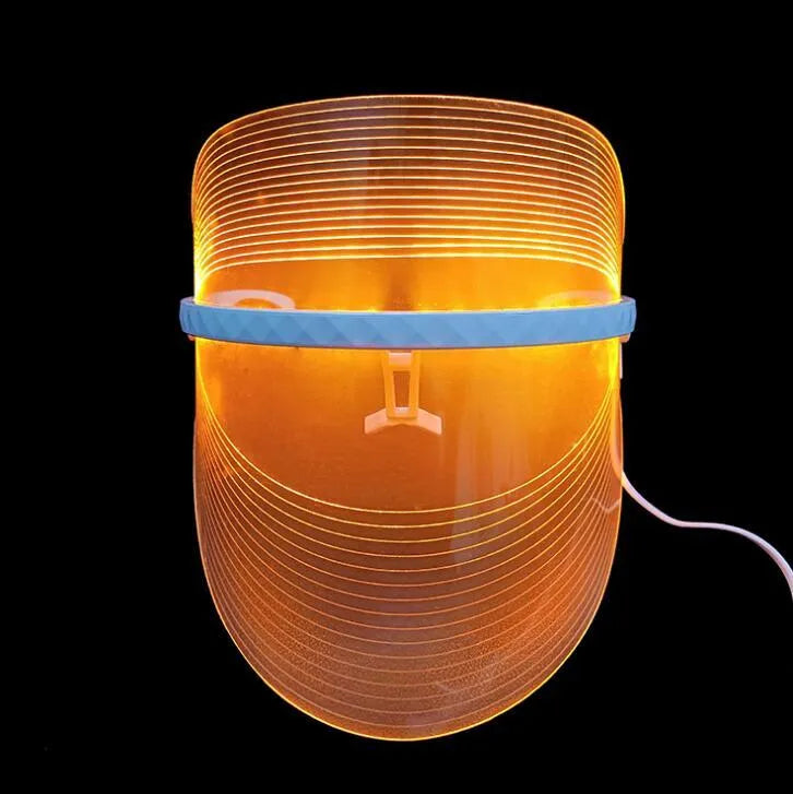 Transparent ABS LED light therapy face mask with red, yellow, and blue lights for home skin care