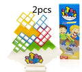 Plastic balance stacking game with coloured blocks on a tilting base, packed in a 26.5 cm box.