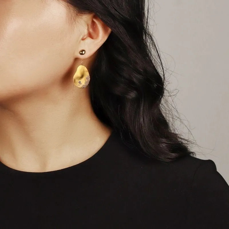 Gold plated asymmetric floral earrings with zircon mosaic detailing in Chinese style design