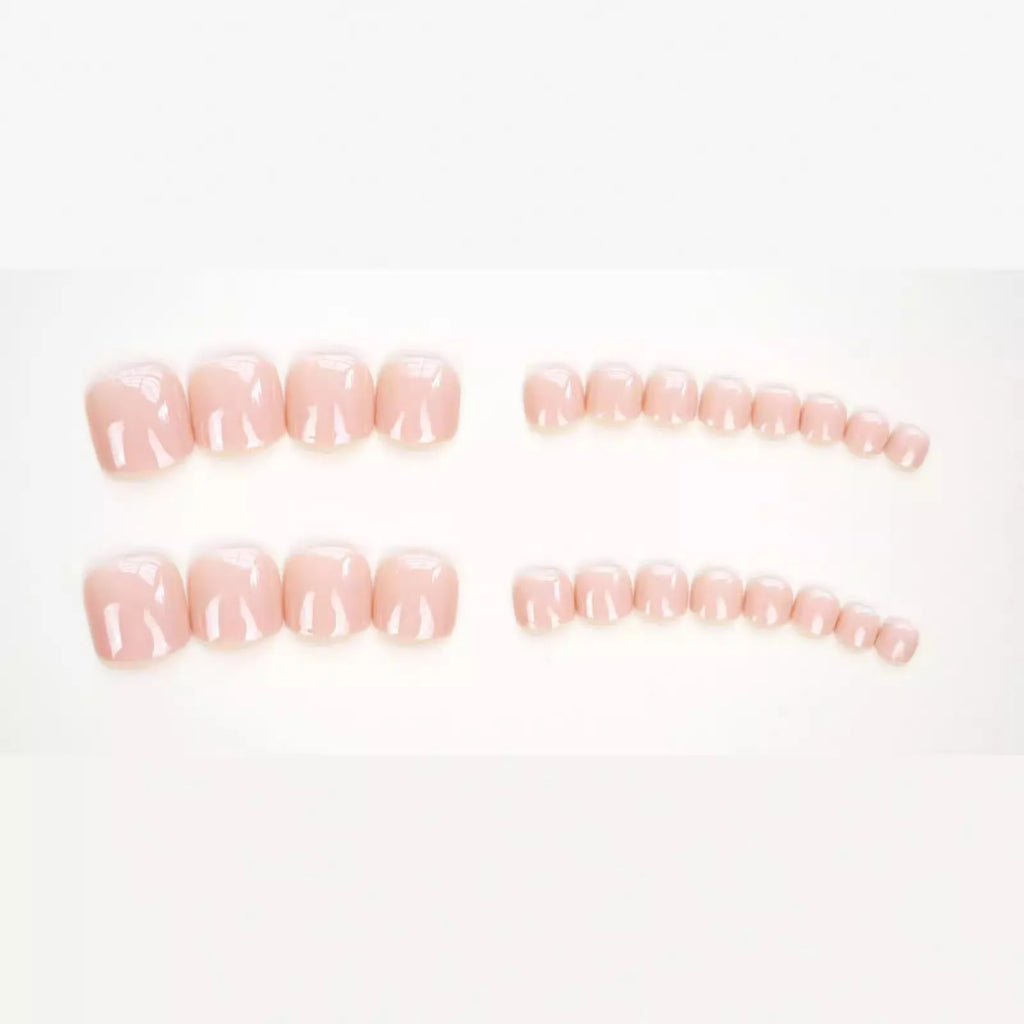 Skin colour glue-on false toe nail stickers in an ins style, supplied with adhesive.