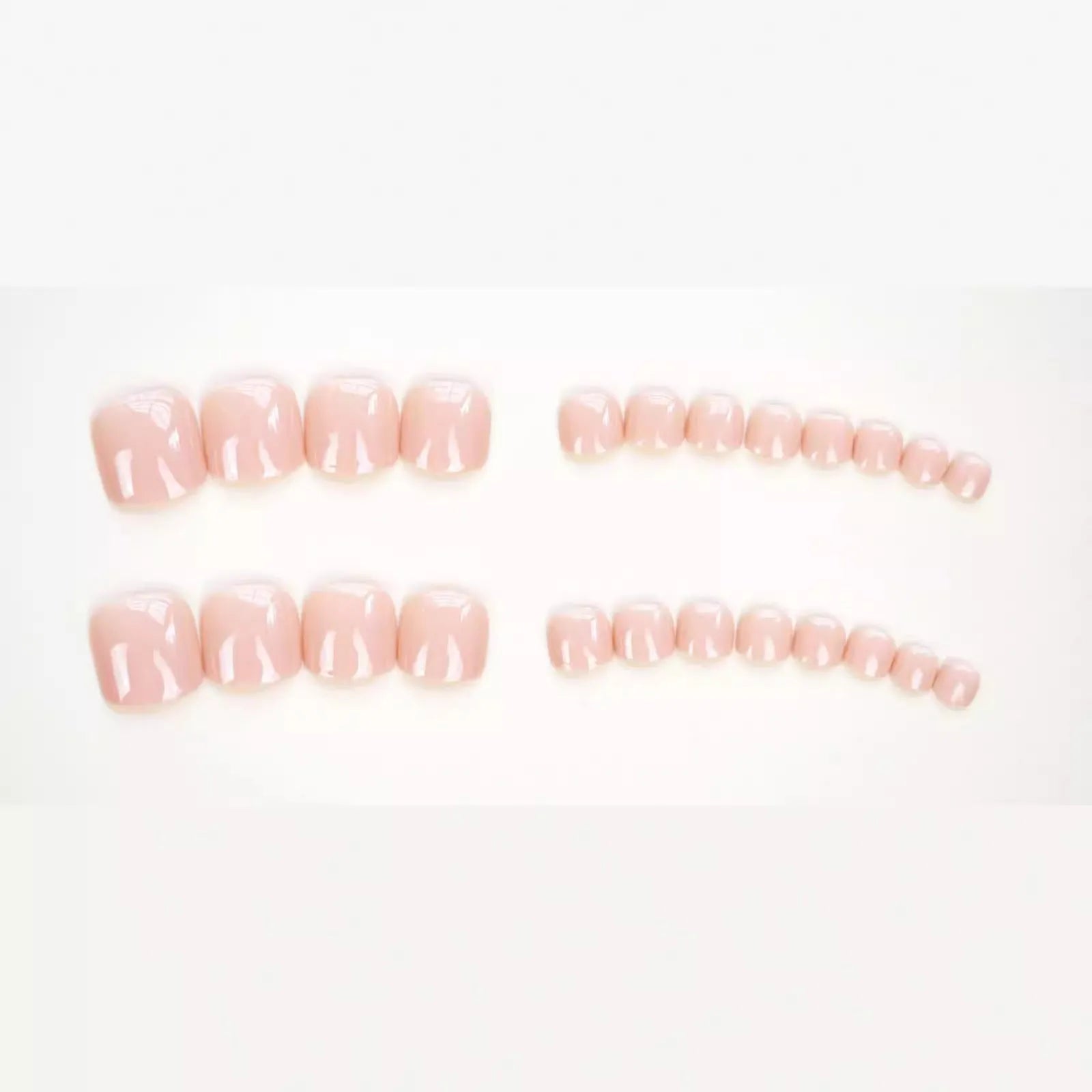 Skin colour glue-on false toe nail stickers in an ins style, supplied with adhesive.