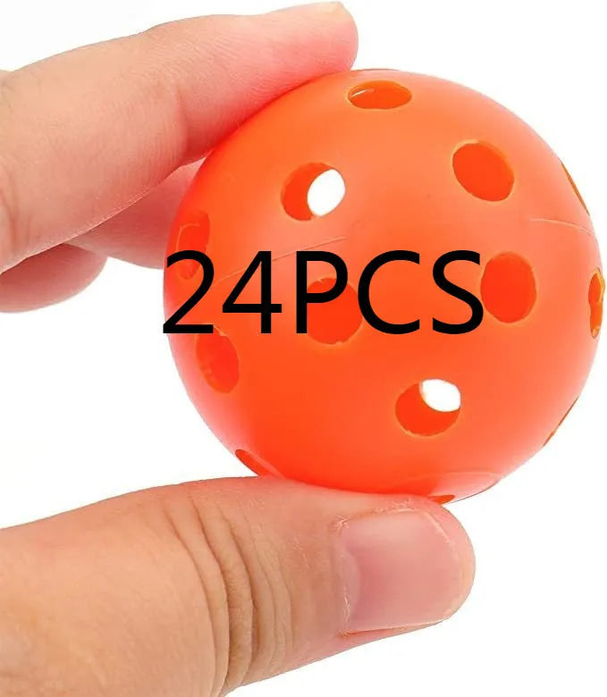 Multi-colour golf practice balls with 26-hole dimples, showing red, orange, blue, green, white, and yellow variants.
