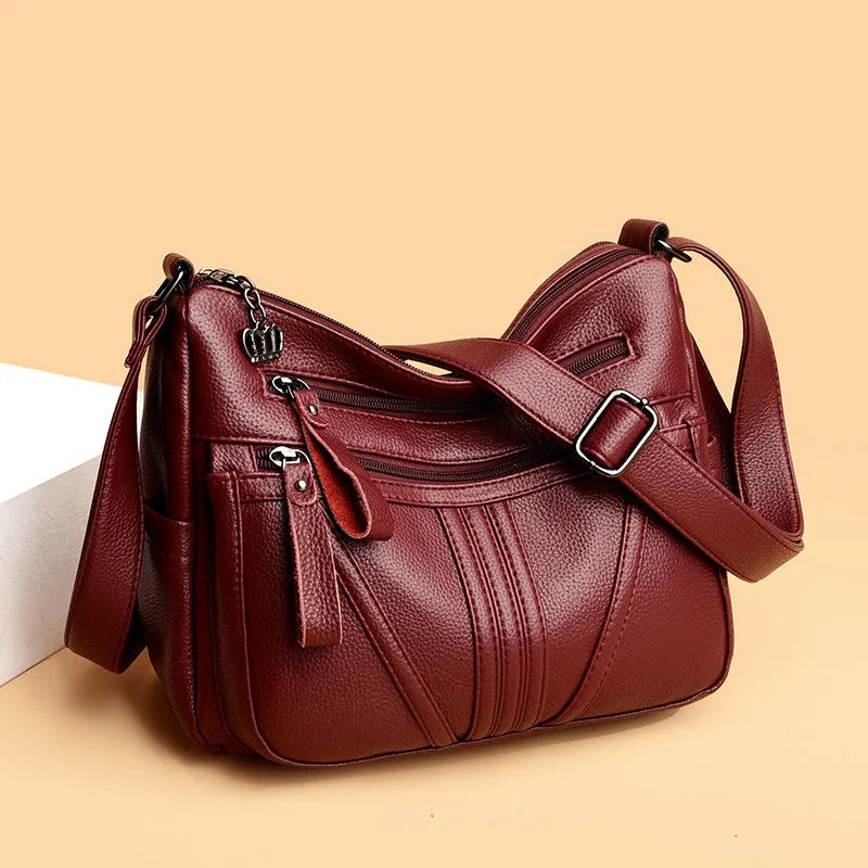 Genuine leather cross-body messenger bag in horizontal square shape with internal organisers
