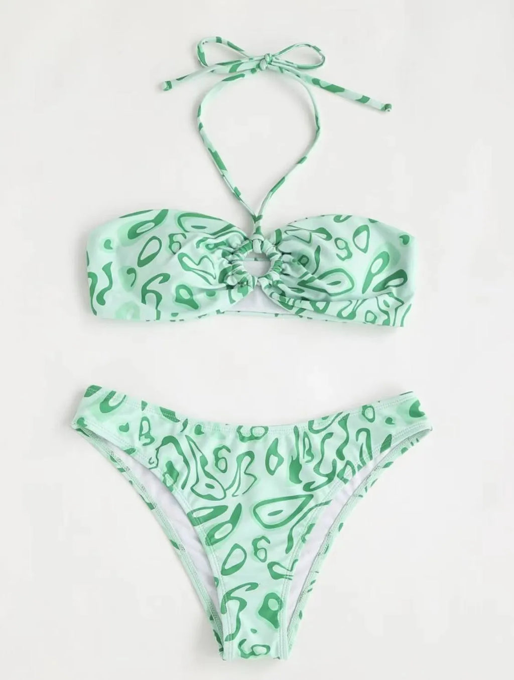 Green floral bandeau bikini swimsuit with split design and adjustable straps on mannequin