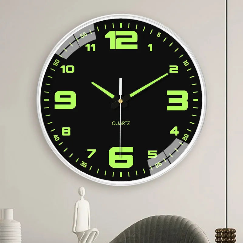 Modern 8 inch circular wall clock with luminous numerals on a white wall