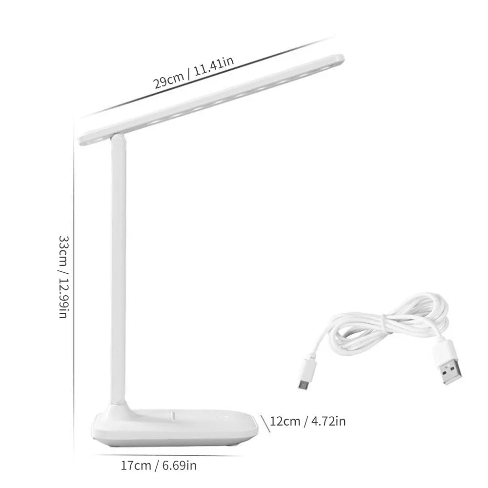 White plastic bedside lamp with touch dimming and colour-changing LED light on a table.