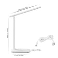 White plastic bedside lamp with touch dimming and colour-changing LED light on a table.