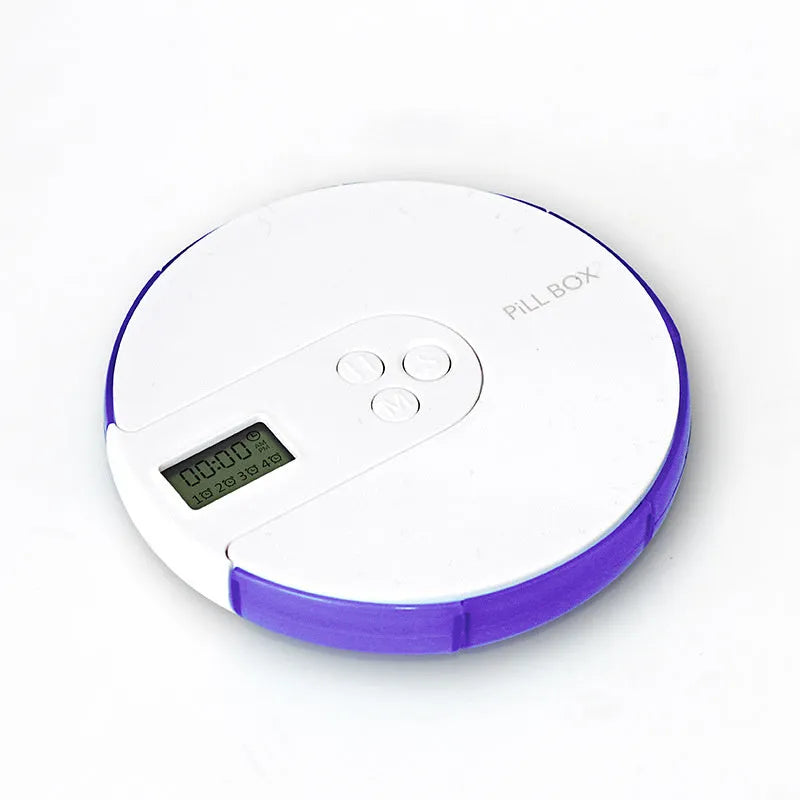 Blue seven-compartment electronic pill box with digital display and alarm clock, shown next to pills.