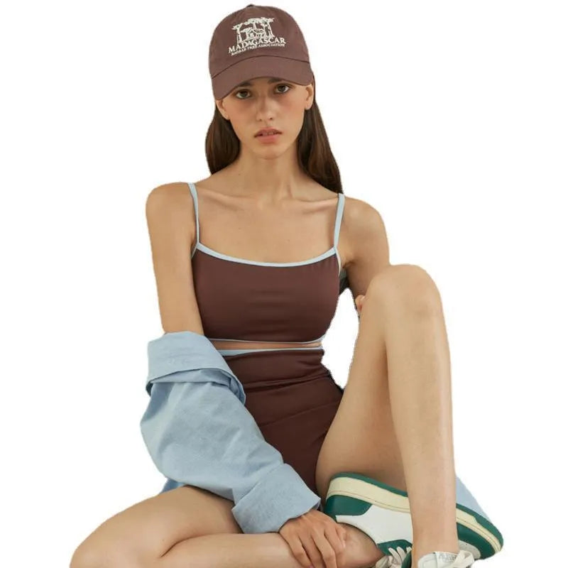 Brown one-piece swimsuit for women on a mannequin, showing the front design.
