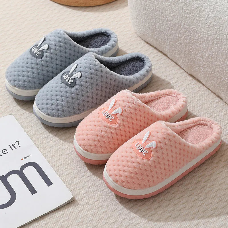 Women's rabbit plaid artificial fur house slippers with a flat heel and rubber sole, shown in apricot colour.