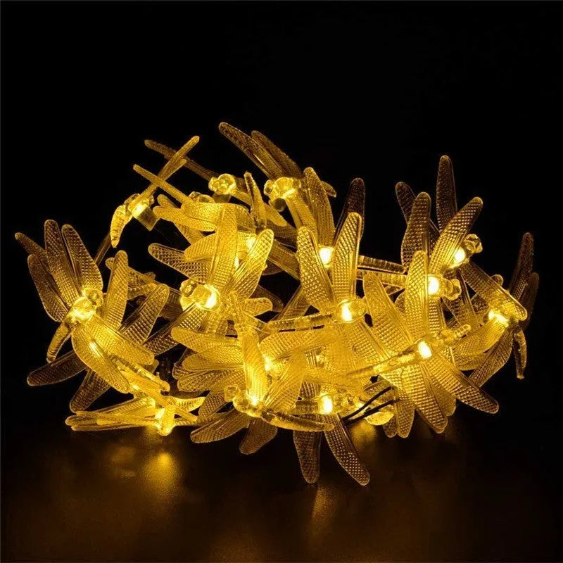 Outdoor solar LED string lights with dragonfly solar panel showing 5 metre length and IP65 waterproof construction