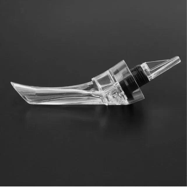 Compact clear acrylic wine aerator with a stainless steel filter, measuring 16cm long.