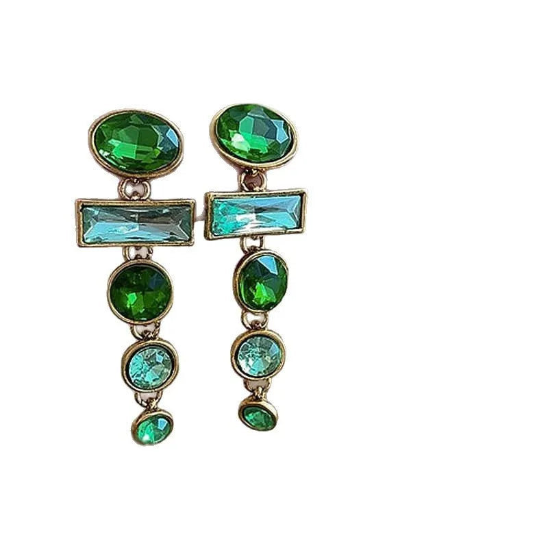 Retro green gradient geometric stud earrings with long silver tassel drop on a white background.