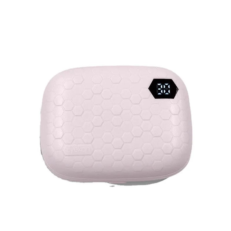 Pearl white automatic ultrasonic flushing instrument for cleaning invisible glasses on a table.
