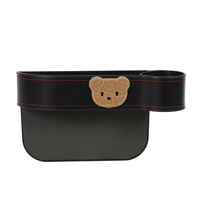 Leather car seat gap storage box with cartoon bear design hanging between vehicle seats