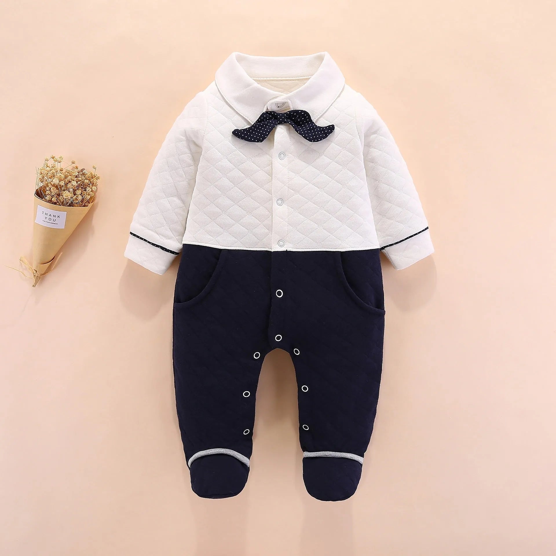 Baby boy British-style cotton onesie in navy blue with long sleeves and single-breasted front
