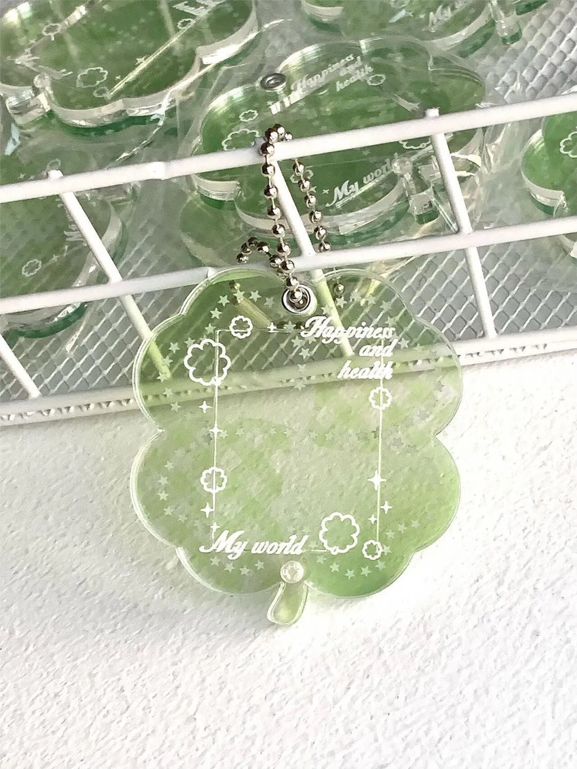 Acrylic four-leaf clover charm pendant keychain in blue, green, and mint colour options
