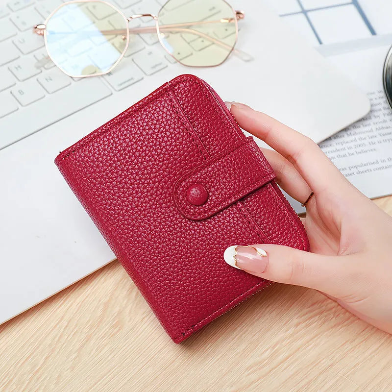 Ladies short wallet with lychee pattern in beige, pink, black and red colour options showing two-fold design