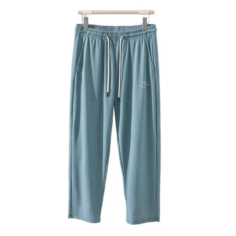 Men's thin grey ice silk casual trousers with a loose straight-leg fit and ankle-tied detail.
