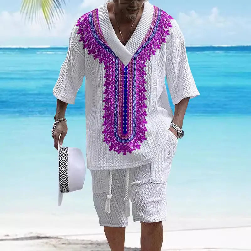 Man wearing a printed drop-shoulder short-sleeved knitted top with matching shorts.