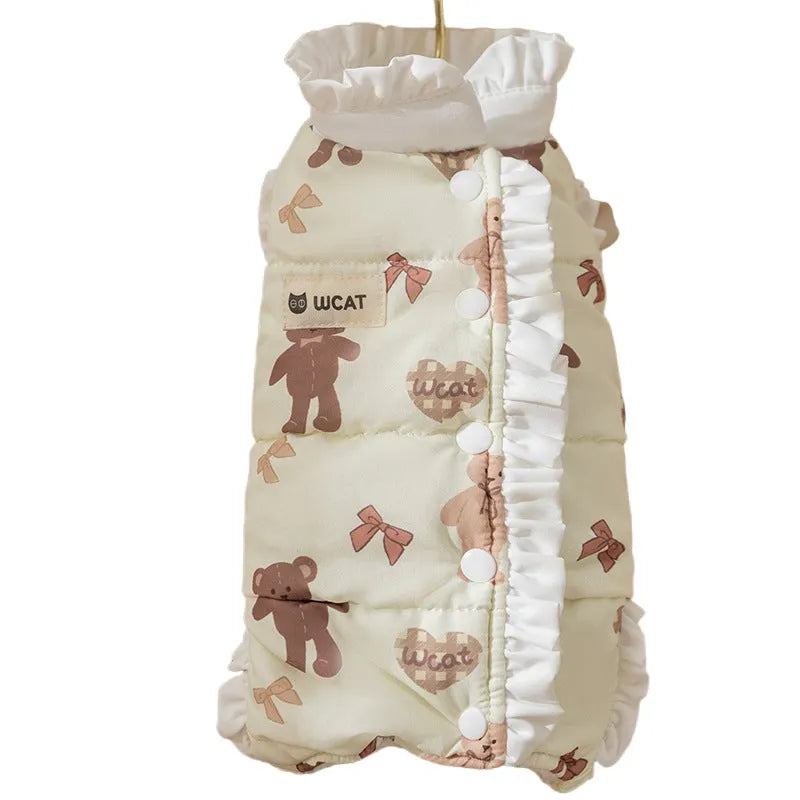 Cream fleece pet jumpsuit with bear print and white ruffles, four-legged design on small dog