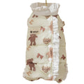 Cream fleece pet jumpsuit with bear print and white ruffles, four-legged design on small dog