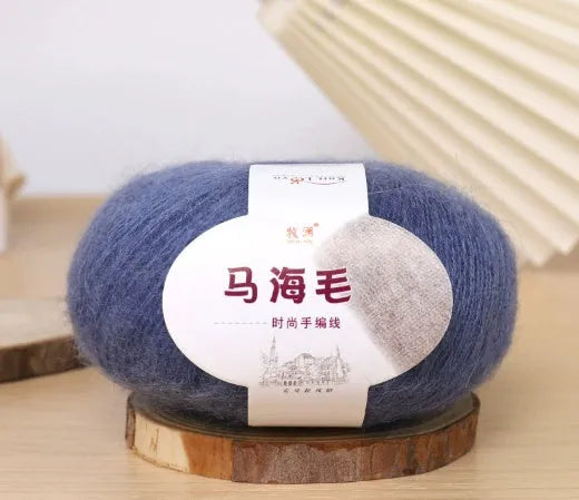 DIY mohair scarf kit showing a ball of mohair thread in a chosen colour next to an example of a hand-woven scarf
