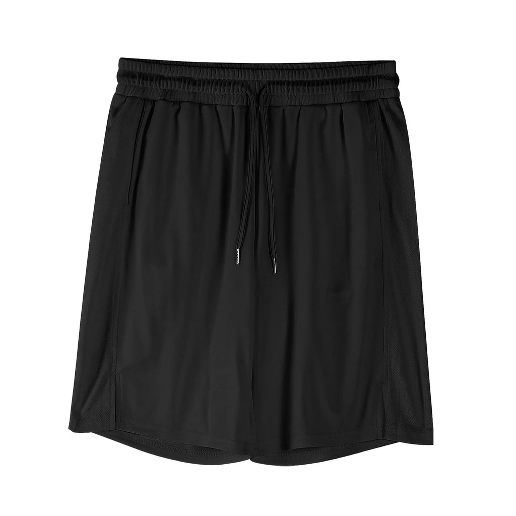 Man wearing black loose-fit quick-drying mesh shorts with an elastic waistband.